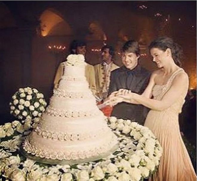 For Cruise and Holmes's Italian wedding, they chose a five-tiered white chocolate mousse cake covered in marzipan roses. Photo: Instagram
