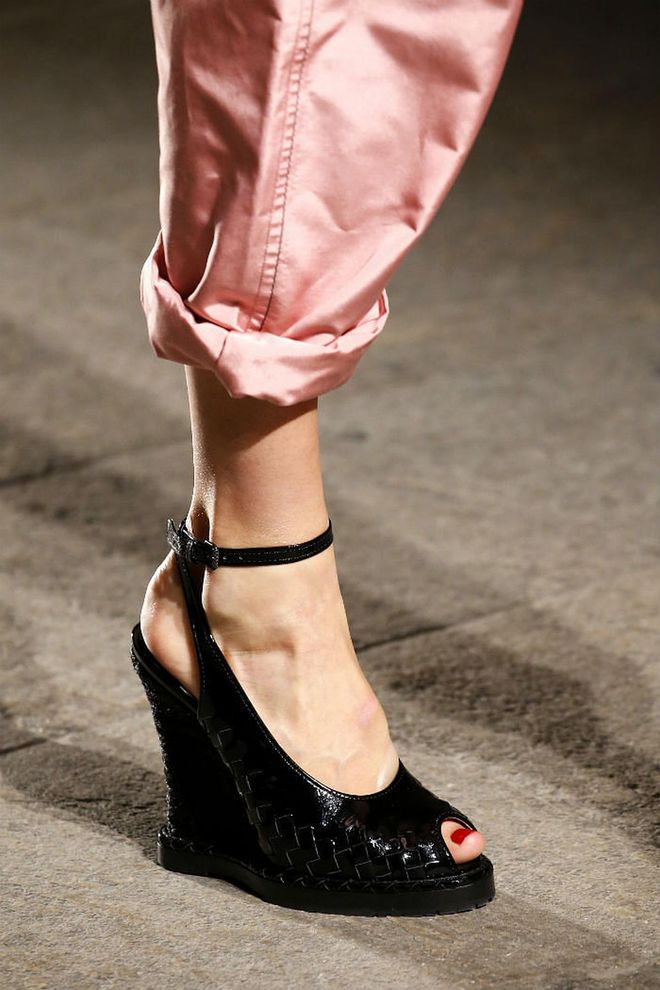 Seen in: Milan Fashion Week SS17 // Subtle details give classic designs a sophisticated twist. Seen here in Bottega Veneta's peep-toe wedge pumps are the brand's signature intercciato weave that will make anyone steal glances at it repeatedly (Photo: Getty)