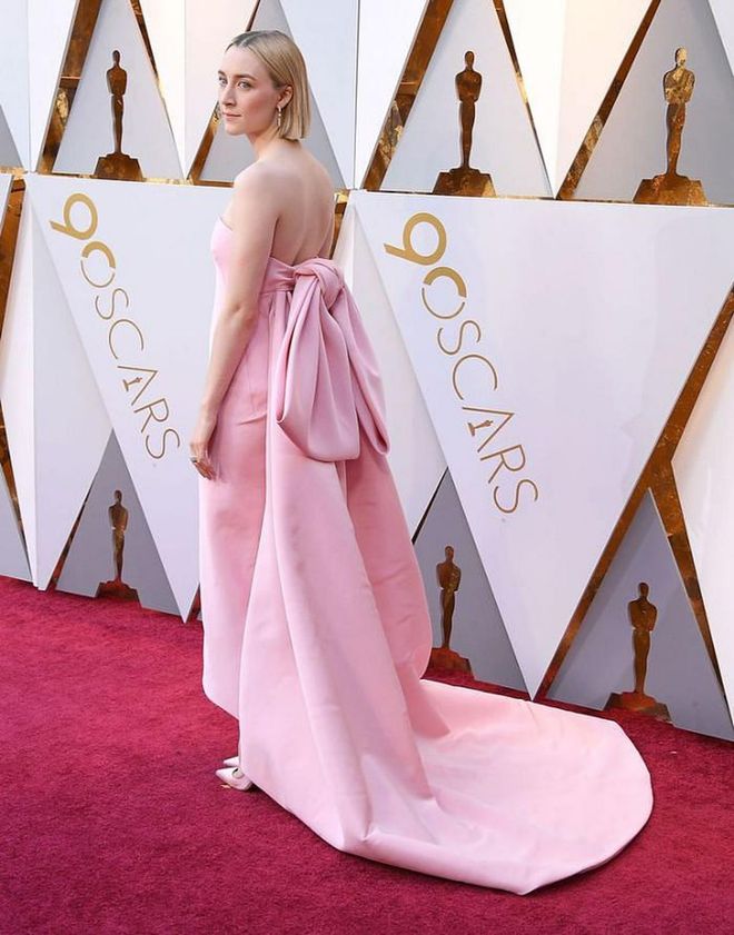 The Best Actress nominee Saoirse Ronan threw a nod to Old Hollywood in this baby pink strapless gown, with an oversized bow in the back.