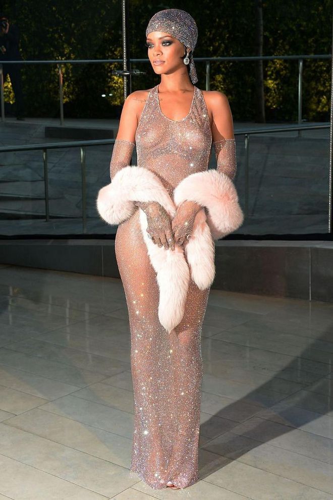What a moment. Rihanna had the fashion equivalent of a mic drop when she arrived at the 2014 CFDA Awards in this entirely see-through, Swarovski-crystal-encrusted Adam Selmen design, paired with matching gloves and headscarf. Add a pastel pink fur stole for some additional Hollywood glam and fashion history was made.

Photo: Getty