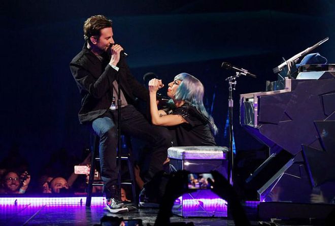 Cooper and Gaga perform during her Vegas residency in January 2019. Photo: Getty