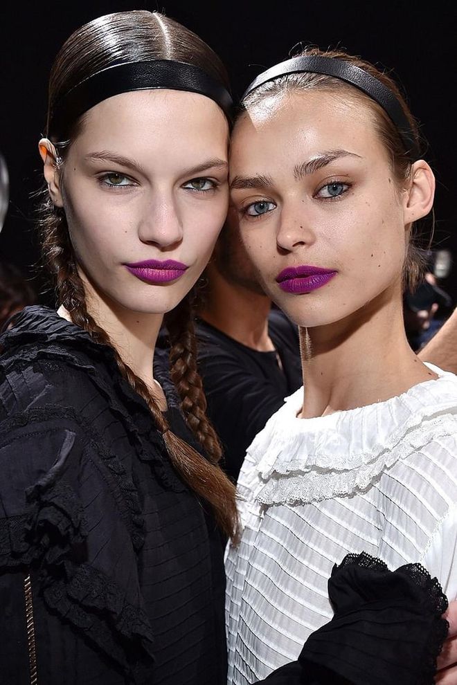 The models at H&M Studio wore their hair in glossy braided pigtails and topped off with a black leather headband.