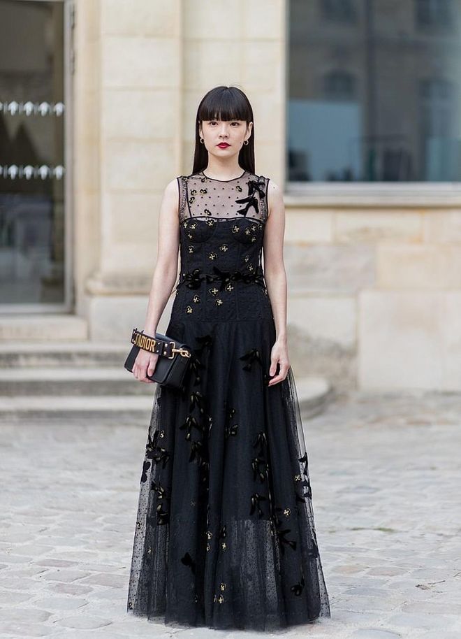 Wearing a black Dior dress. Photo: Getty 