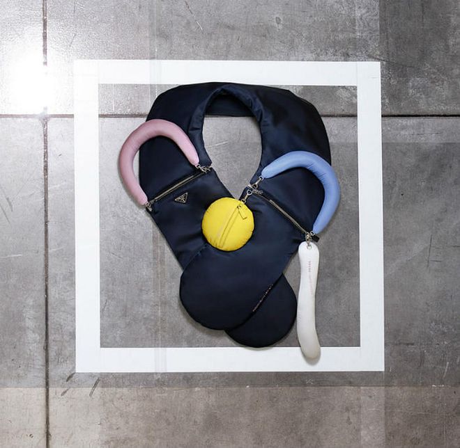 Prada invited 3 female architects—Kazuyo Sejima, Elizabeth Diller and Cini Boeri—to create designs using the classic Prada Nylon for Spring/ Summer 2019.

Pictured here is the curved 'Yooo' bag designed by Sejima, which can be used as a multi-pocket travel bag and neck pillow. Whimsical, fun and functional.