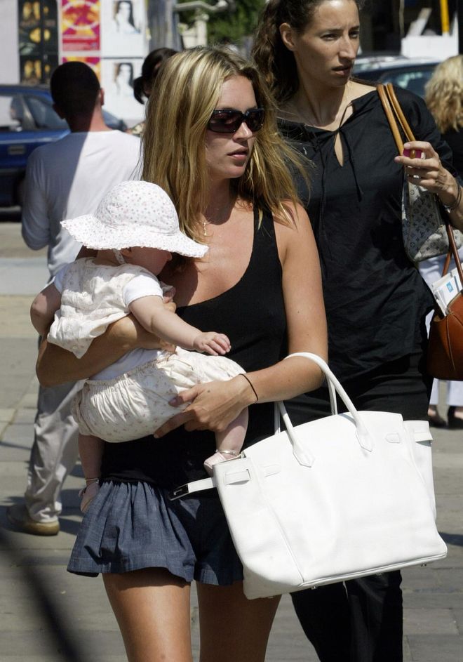 Holding baby Lila Grace on one arm and a white Birkin in another, the supermodel made motherhood look so effortless. Inside, the bag contained Lila Grace's diapers. 
Photo: Getty