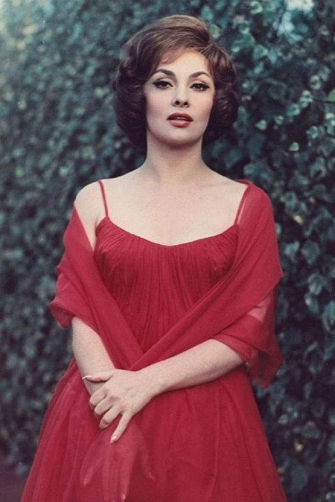 Italian actress Gina Lollobridgida poses in 
 a red dress.

Photo: Getty 