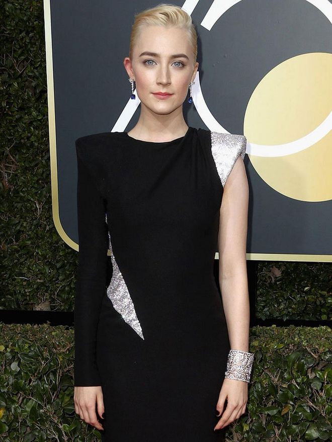 Saoirse is decked out Cartier high jewellery, from her earrings to her exquisite cuff. Photo: Getty 