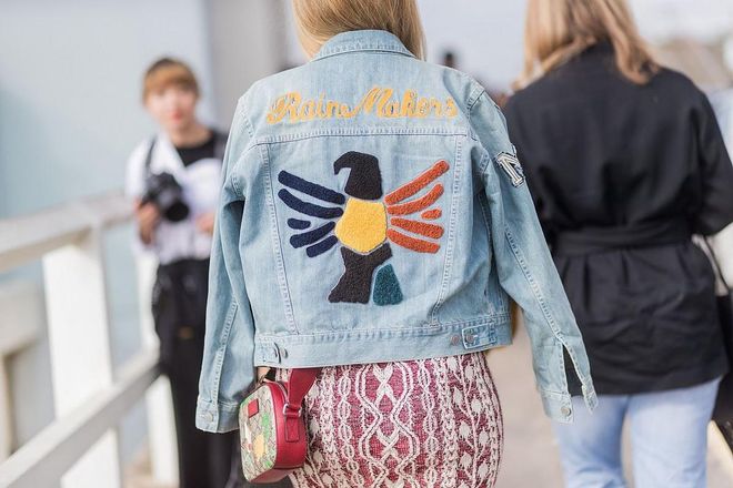 A denim jacket with the print rain maker outside Ten Pieces. Photo: Getty 