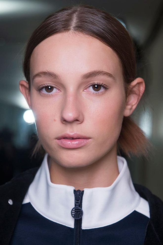The messy knots at Tory burch had a sophisticated feel to them with a shiny, healthy finish. The make-up was kept chic and natural with a hint of pink on the lips and dewy skin.