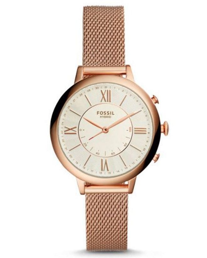 With designs rooted in Americana, particularly print advertisements of the 1930s and ’40s, Fossil has distinguished itself from other watch brands that toot their European origins. It should come as no surprise, then, that the label was founded by a Texan, Tom Kartsotis, who gambled all his savings in 1984.

His bet proved successful. From an initial offering of 1,500 pieces, produced in Hong Kong, Fossil has since conquered markets worldwide, subsequently licensing the names of fashion labels like Marc Jacobs, Michael Kors, Tory Burch, and Emporio Armani. It also still creates timepieces under its own moniker, creating an exclusive women’s line in 1989 that leaned toward Art Deco designs, and an online platform, Jacqueline, in 2011, which offers a wide array of styles.  

Pictured:  Fossil Hybrid Smartwatch in Rose Gold-Tone Stainless Steel