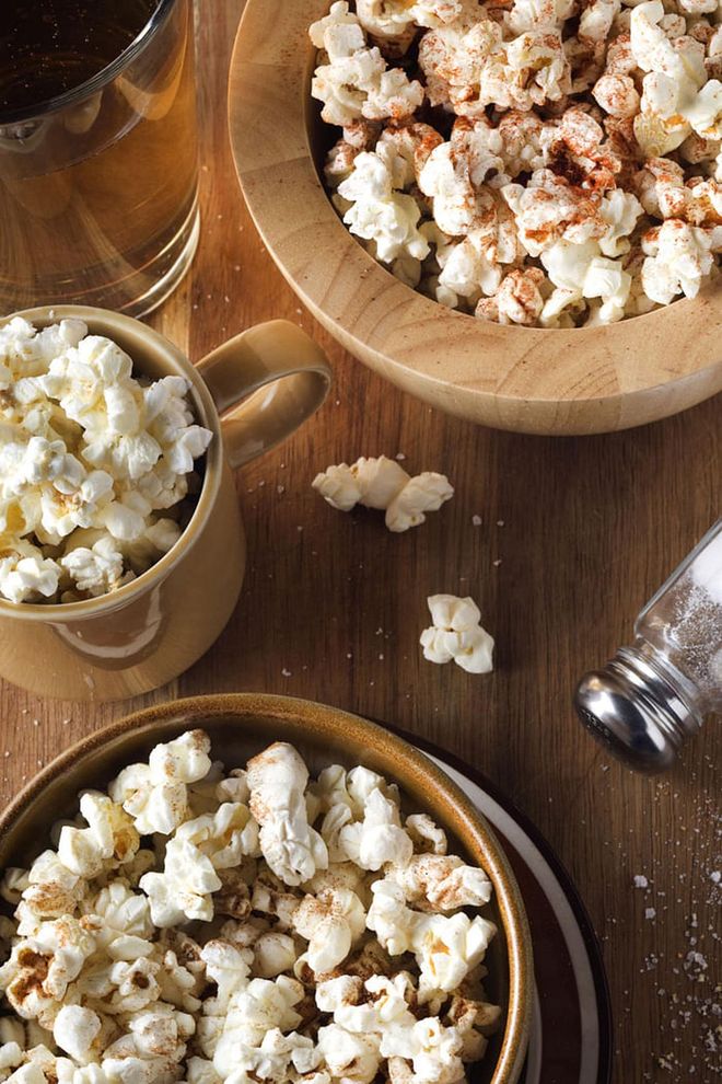 Swap your crisps for popcorn the next time you're peckish. In a study that compared the short-term satiety of these two popular snacks, food and health researchers from around the country found that most volunteers reportedly felt less hunger and more satisfaction after eating popcorn. If you're more satisfied, it is likely that you'll be eating less, ergo, taking in fewer calories.