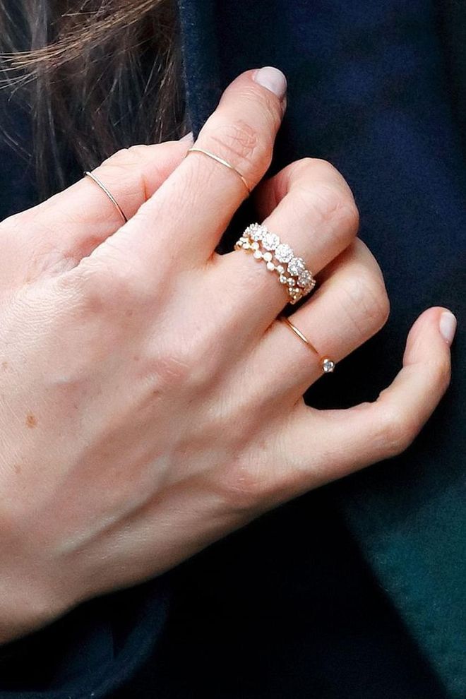 While not everyone can afford multi-carat diamonds, this is one Meghan-inspired jewelry look more people can get in on. On a visit to Scotland she wore a $60 Missoma Interstellar Ring and a majorly affordable $44 Catbird Threadbare Ring. Photo: Getty
