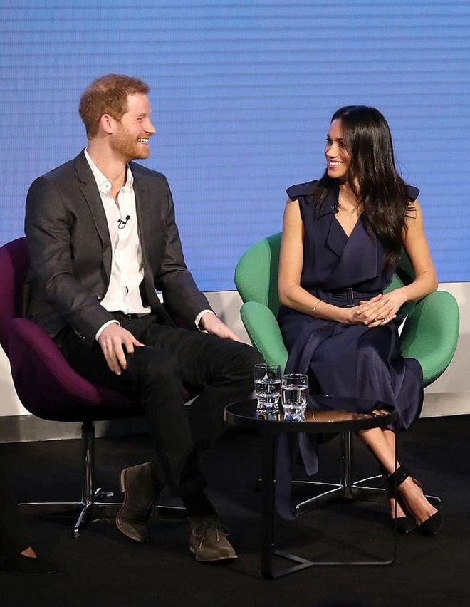 Meghan Markle took inspiration from Michelle Obama and opted for a navy wrap dress by Jason Wu for her first ever Royal Foundation Forum. She paired the dress with simple black suede pumps by Aquazzura. 