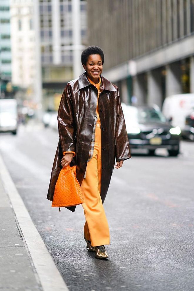 For those who wear a lot of color to the office, layer brighter hues underneath a dark-colored trench coat for balance. Keep the accessories minimal, as the bold hues are sure to stand out.

Photo: Edward Berthelot / Getty