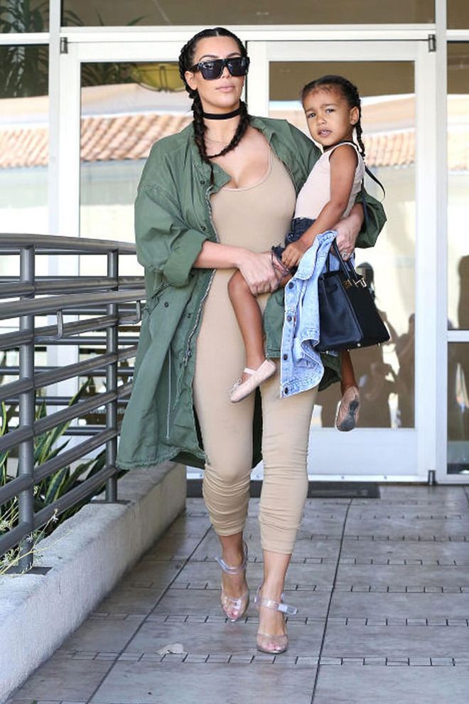 Demonstrating once again how to do matching mommy and me style, Kim Kardashian and North West had a girls day out in LA wearing coordinating looks. The duo donned French braids, black chokers and nude bodysuits (although North tucked hers into a pair of denim cutoffs and opted for a pair of ballet flats instead of lucite heels). Photo: AKM-GSI
