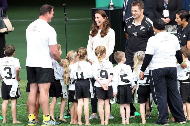 Middleton attends a kid's rugby game in Australia. She's seen here laughing along with the little rugby players and their coach. Photo: Getty