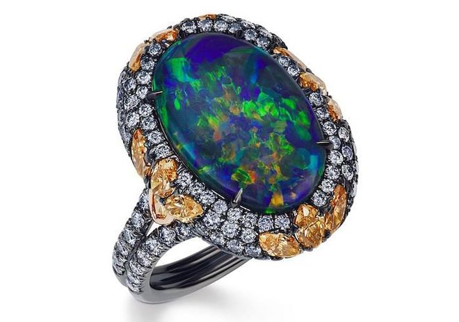 18kt platinum ring with opal, orange diamonds, and blue diamonds, $70,000, jfineinc.com for inquiries.
