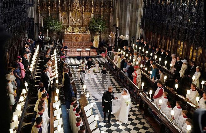 Prince Harry, Duke of Sussex and The Duchess of Sussex leave following their wedding