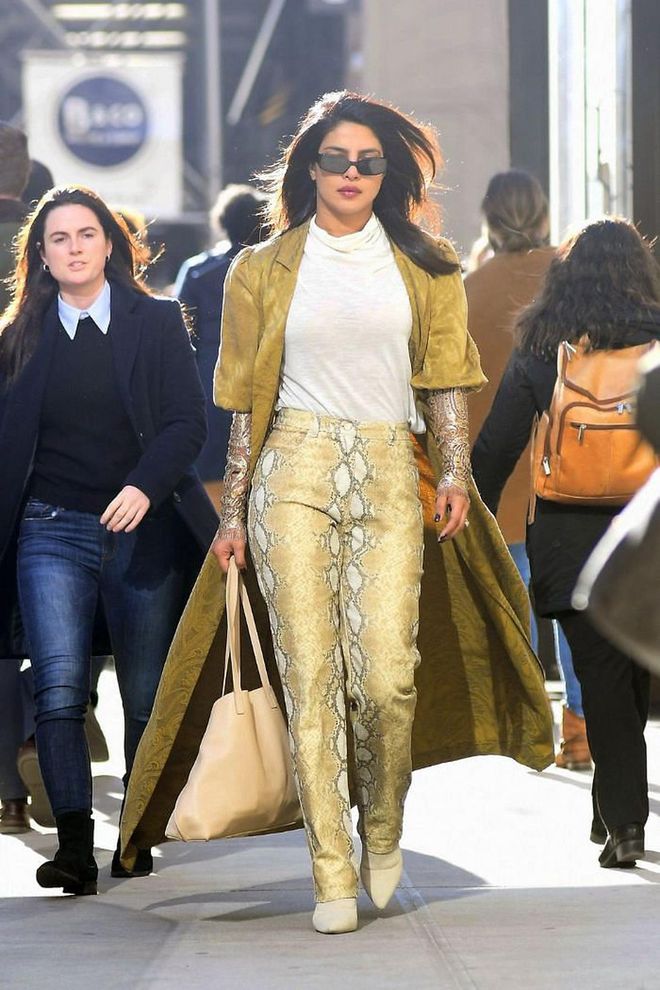 While out in New York, the actress served up a killer street style look in snake print pants and a floor-length duster jacket.

Photo: Splash News
