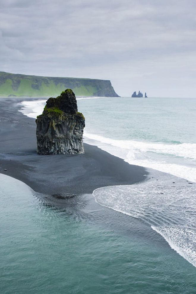 Iceland isn't exactly a beach vacation destination, but the black sand and rock formations at Reynisfjara Beach on the south coast are worth visiting for the views—even if you have to wear a coat. Photo: Getty