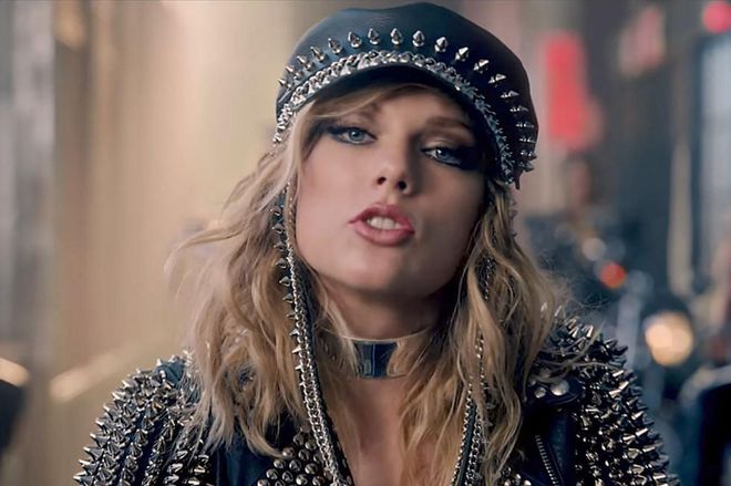 Coming to a biker gang near you, studded-leather Taylor can be seen with gunmetal-gray under-eye shadow, sheer-peach lips, and textured waves.