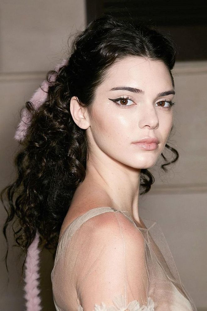 At the Fendi couture show in 2016, Kendall Jenner traded in her usual glossy waves for coiled, half-up curls. Photo: Getty