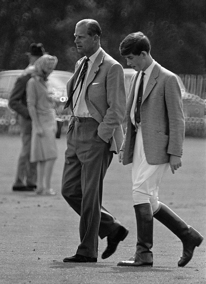 Prince Philip walking with his son Prince Charles at Smith's Lawn in Windsor Great Park.