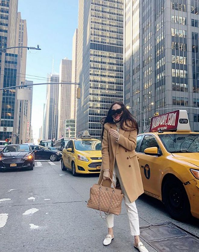 Braving the big chill for NYFW, Jung wears a pair of Blanc and Eclare jeans with matching Gucci loafers. She also matches her wool camel coloured coat with a Chanel Be CC beige tote from Cruise 2012. 
Photo: Instagram