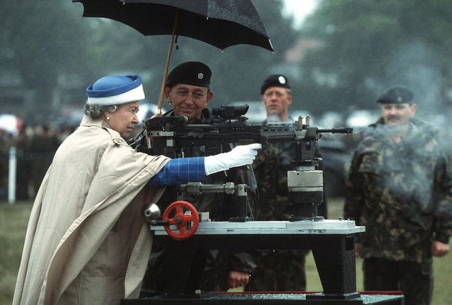 The Queen shoots a machine gun in an undated photo. Photo: AP 