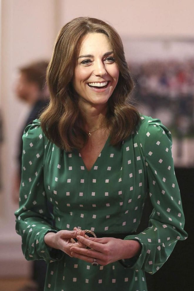 Kate smiles in another all-green ensemble during day three of her Ireland visit.

Photo: Getty