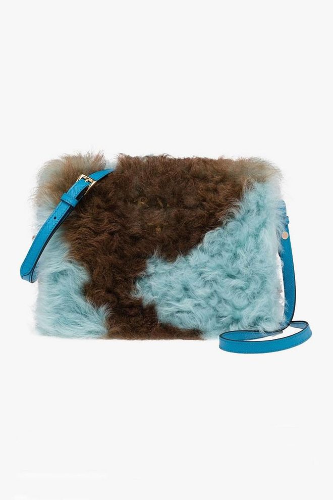 Inject a sense of playfulness into your new season wardrobe with one of Prada's two tone shearling bags.