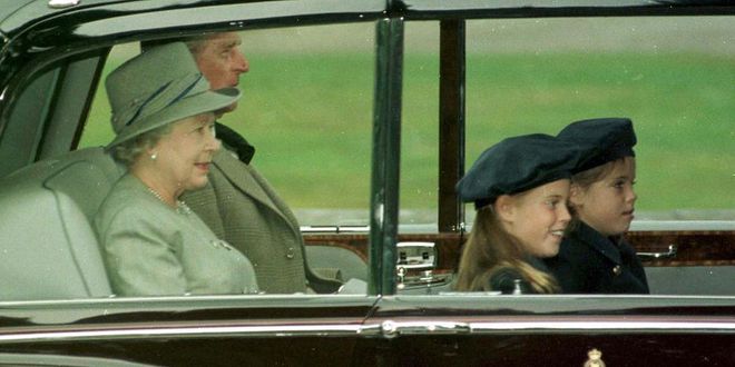 The Queen and Duke of Edinburgh ride in a car with Princess Beatrice and Princess Eugenie. Photo: Getty