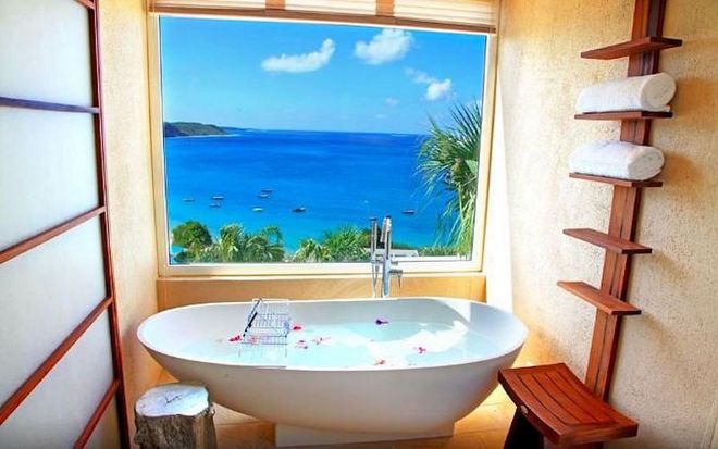 This villa on the Caribbean island of Anguilla comes with a private beach and full-service spa. But, really, you could just spend your entire time in that rose petal-filled bath tub overlooking the Caribbean sea. Dreamy.